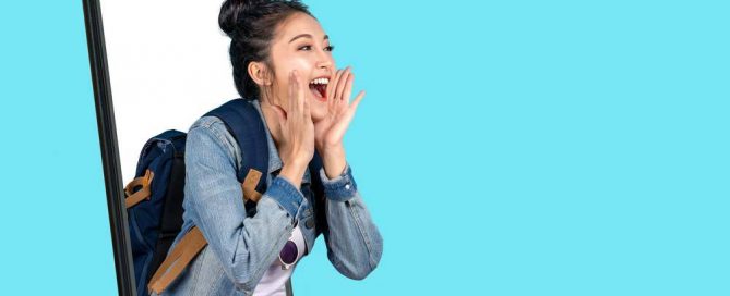 Happy young girl coming out of mobile phone