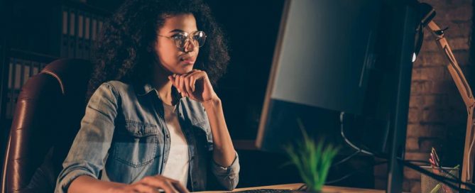 Young woman working on her desktop