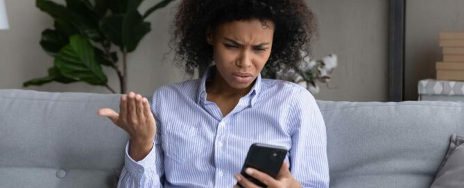 Woman disappointed looking at the phone