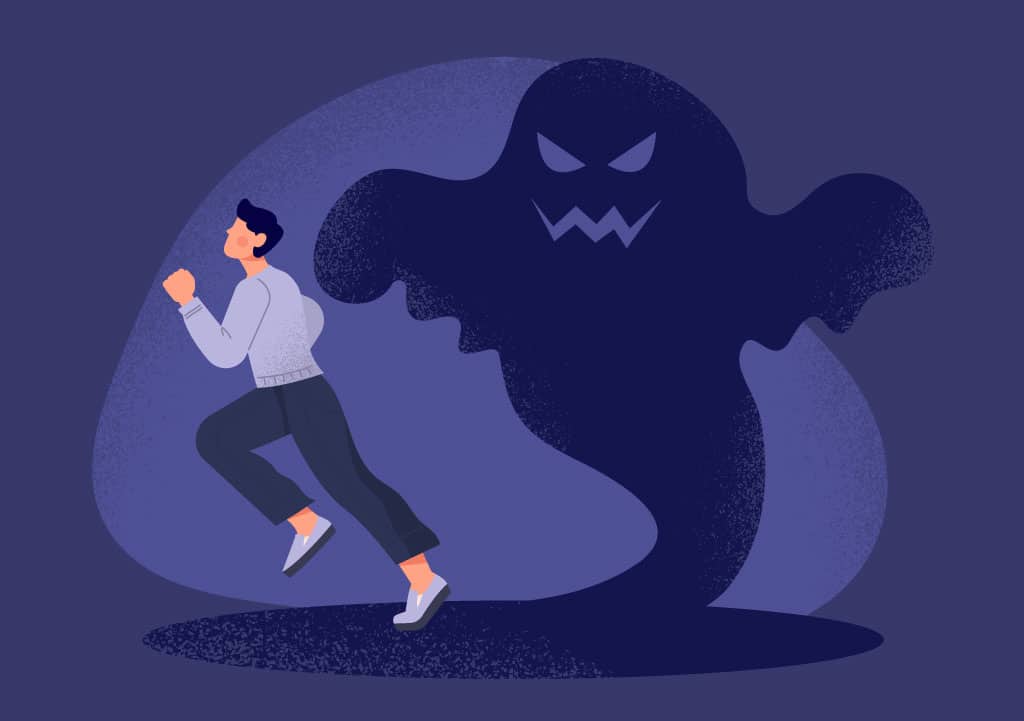 Man running from a scary shadow